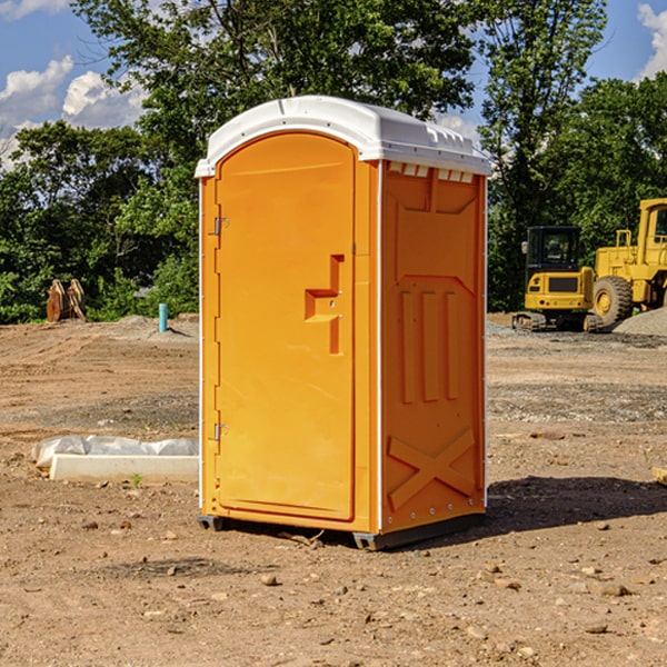 what is the cost difference between standard and deluxe portable toilet rentals in Des Peres